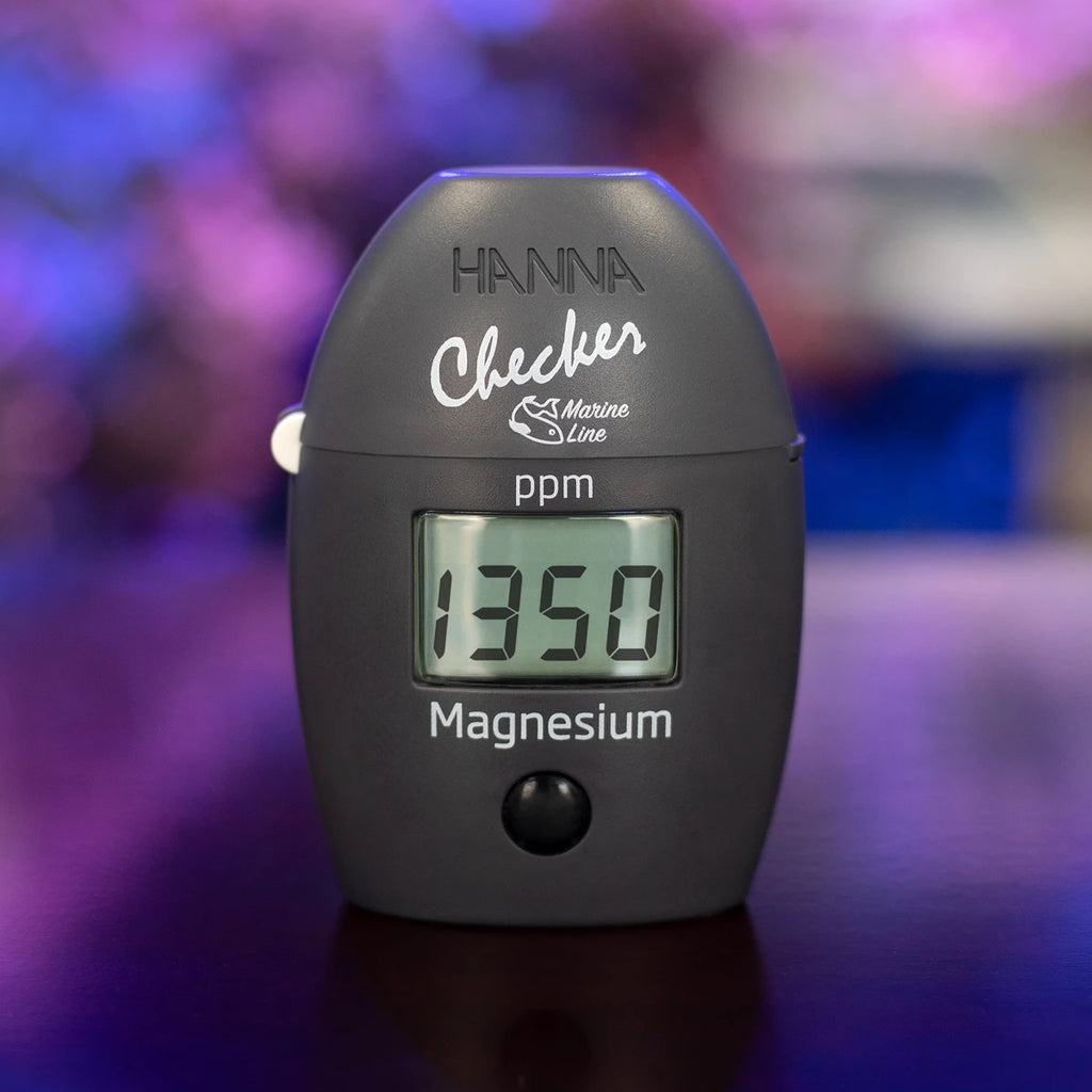 Hanna Checker HC HI783 marine magnesium in front of a reef aquarium