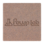 Polyplab Genesis Rock, top-down close-up of one rock showing the engraved logo and surface texture