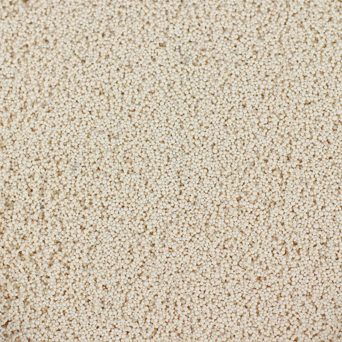 Seachem Purigen — close-up of the fine beige resin beads, official manufacturer image