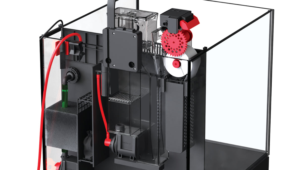 Red Sea NanoMat installed in an aquarium's rear filtration compartment, near the pump and tubing